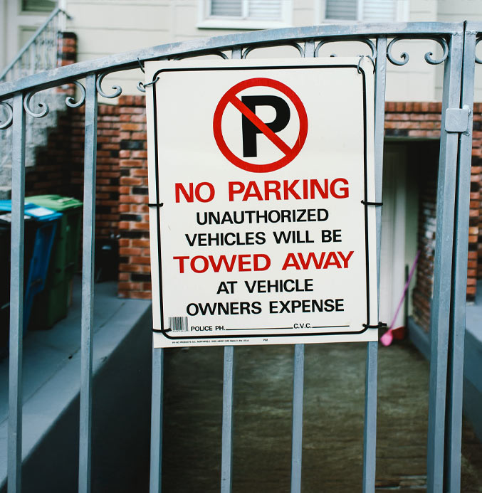 Dallas HOA Parking Enforcement Company Texas Towaway No Parking Sign on Gate